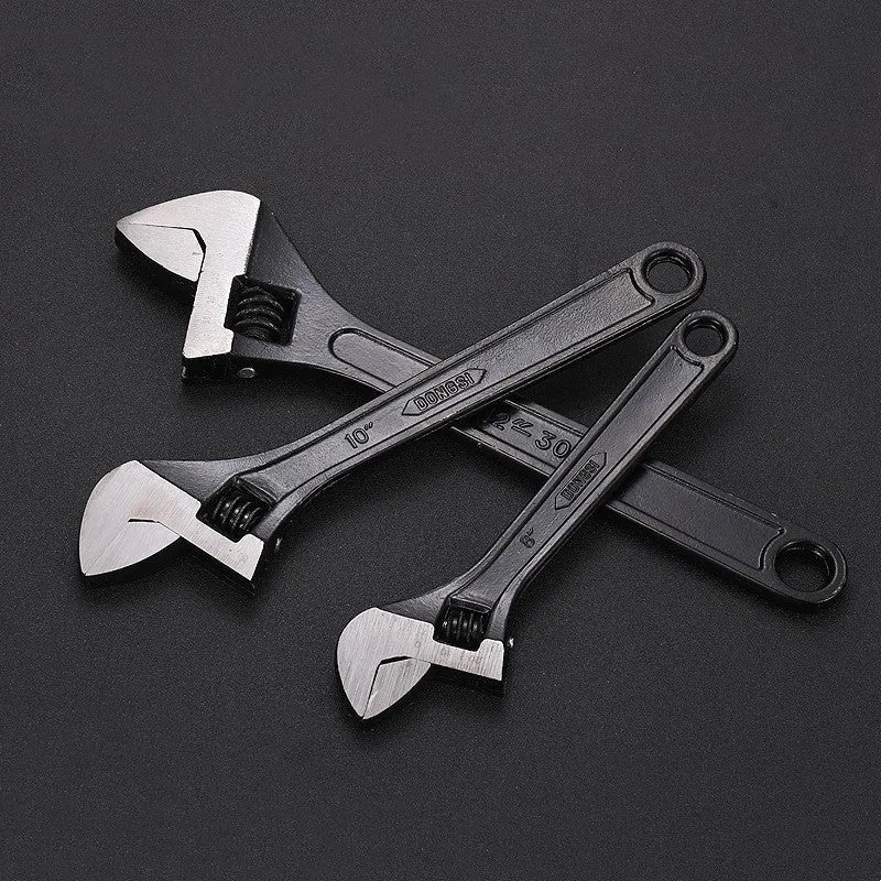 Blackened high carbon steel adjustable open-end wrench showing adjustable jaw mechanism and ergonomic handle