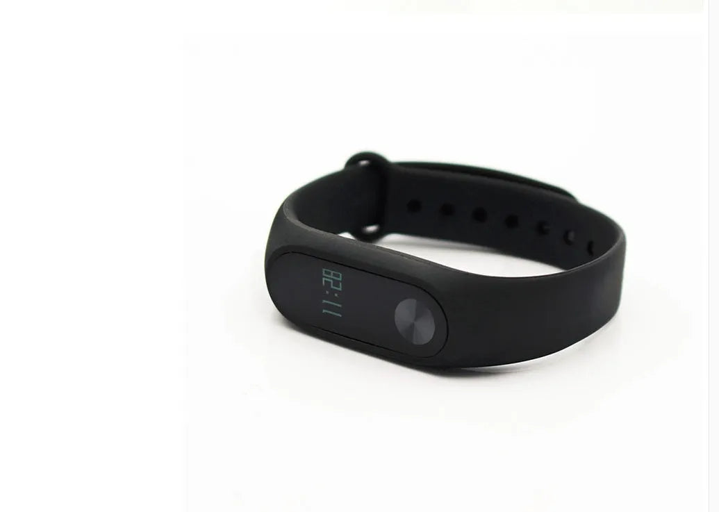 Xiaomi Mi Band 2 black fitness tracker with OLED screen on a wrist