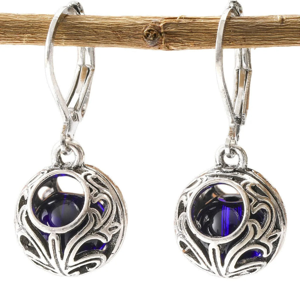 Women's geometric earrings with vintage engraving and hollow blue gemstone pendants in silver colour