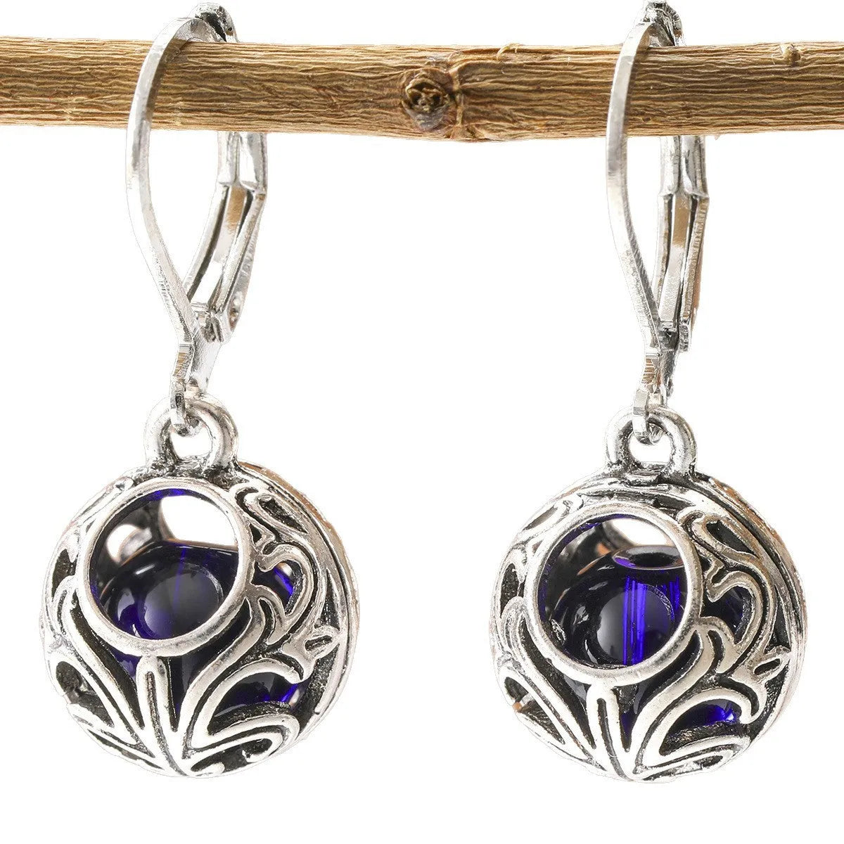 Women's geometric earrings with vintage engraving and hollow blue gemstone pendants in silver colour