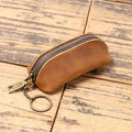 Men's leather clutch coin purse in first layer cowhide with chain, shown in brown yellow, dark brown or black