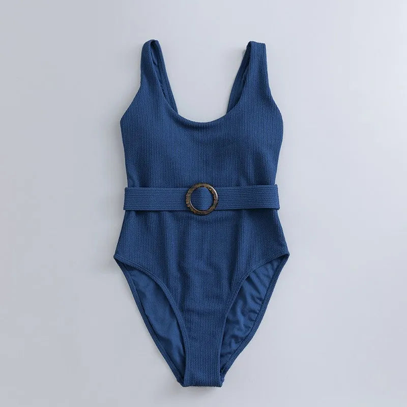 Navy blue women's one-piece triangle swimsuit on a hanger.