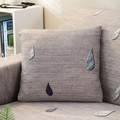 Printed geometric stretch sofa slipcover fitted on a three-seater sofa