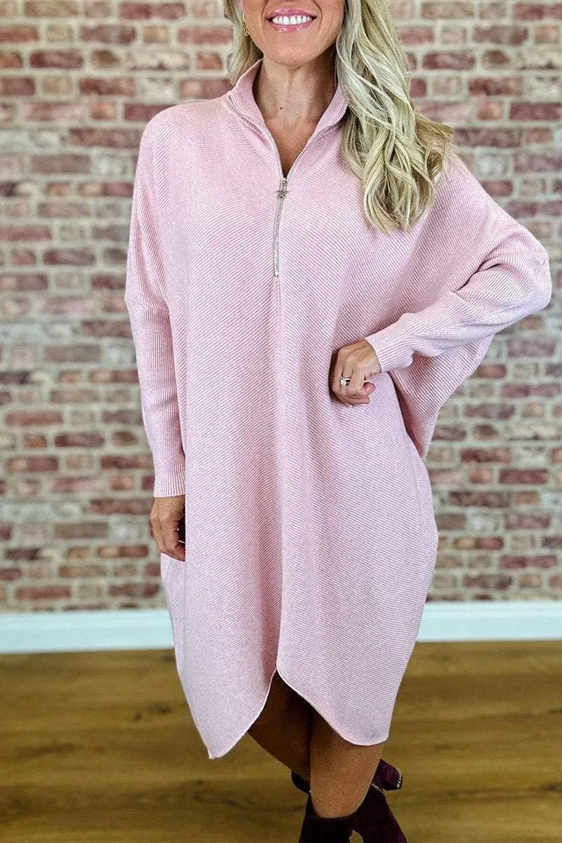 Women's solid colour loose fit knitted dress with raglan sleeves and a zip detail.