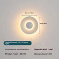 Round aluminium wall lamp mounted on a wall, showing LED illumination.