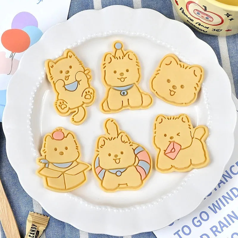 Three-dimensional plastic biscuit mould for making puppy-themed cookies with seven dog cartoon designs