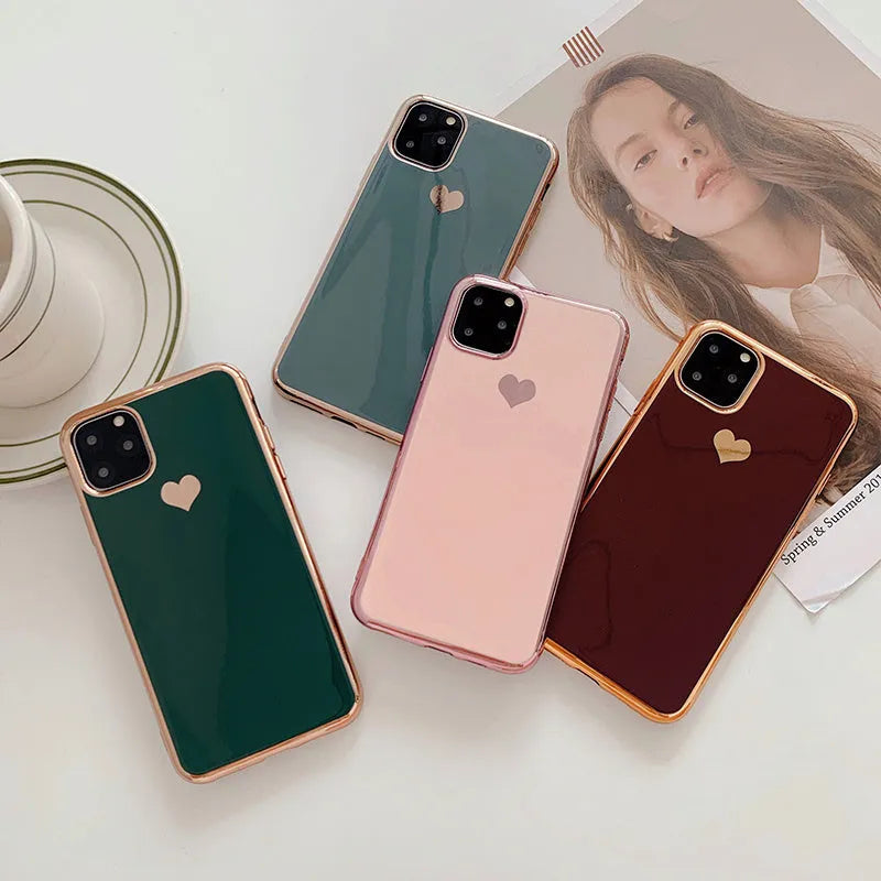 A solid colour TPU back cover case for an iPhone, shown in blue, claret, pink, and green colour options.