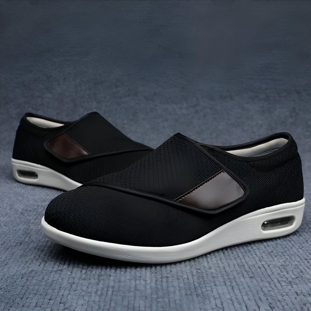 Beige wide-fit leisure shoes with velcro strap and rubber foam sole on a neutral background.