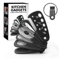 Six kitchen gadgets including wire whisk, dough scraper, potato peeler, garlic press, pizza cutter and bottle opener in colour box packaging