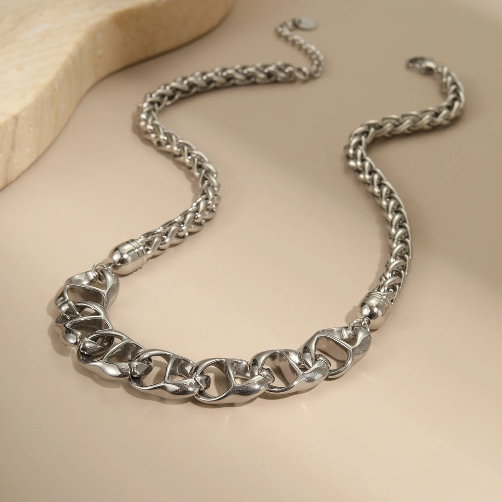 Stainless steel geometric necklace with 18K gold plating in gold and steel colour options