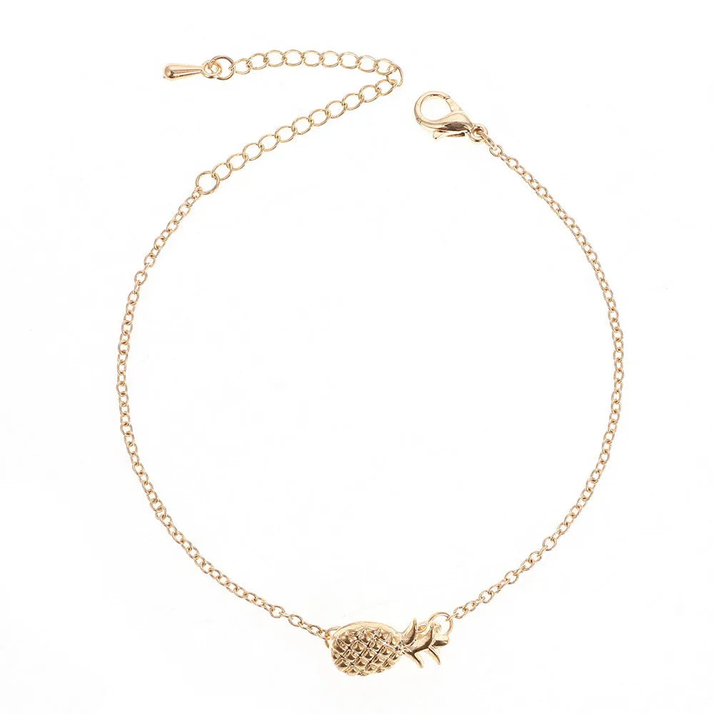 Gold or silver alloy bracelet with a detailed pineapple charm on a simple chain.
