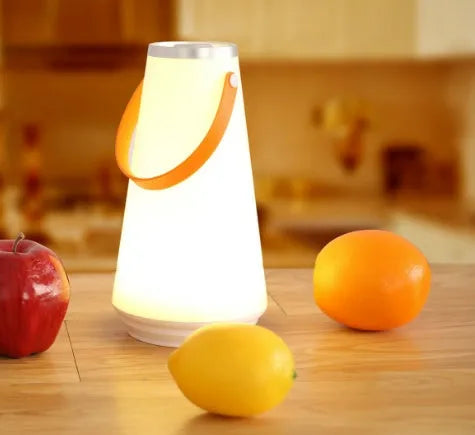 White rechargeable LED table lamp with adjustable brightness settings measuring 12x12x22cm