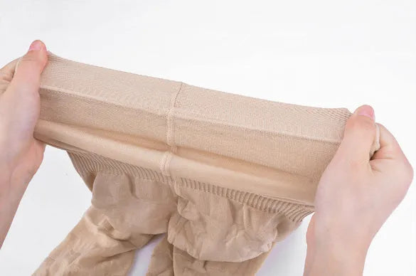 Women's seamless high waist shapewear short for tummy control in black or nude.