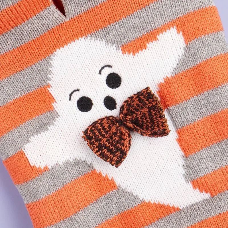 Orange knitted pet sweater with striped pattern, hood and fur balls for Halloween