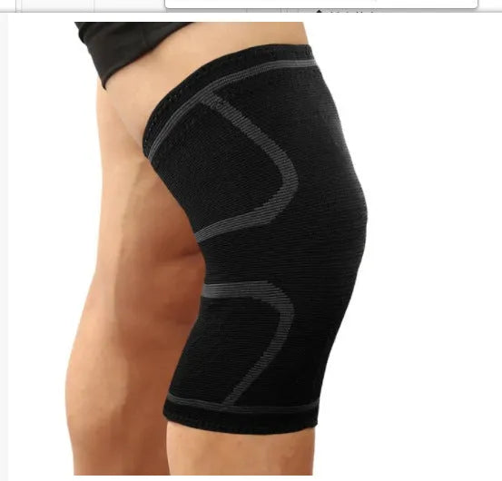 A pair of black stretch sports knee pads on a grey background, showing their non-slip design.