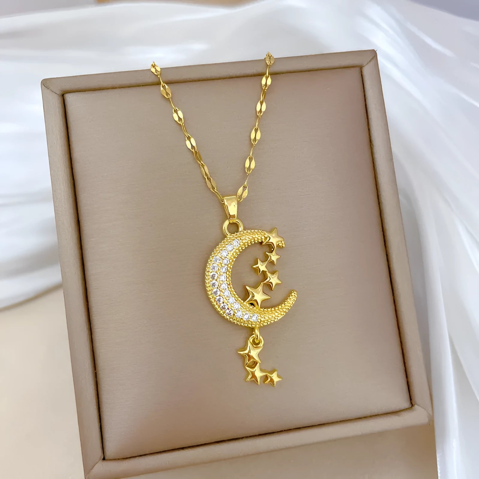 Stainless steel moon pendant necklace with geometric diamond pattern and copper accent