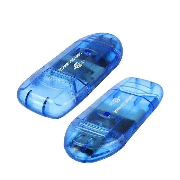 Transparent plastic USB card reader with LED illumination on a desk.