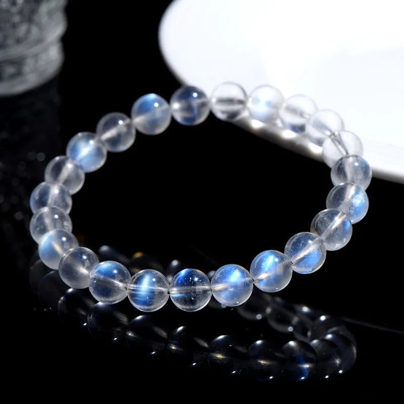 Natural cream body blue moonlight crystal bracelet showing simple design and crystal details.