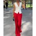 Women's beige polyester two-piece set with sleeveless deep V-neck top and wide-leg trousers