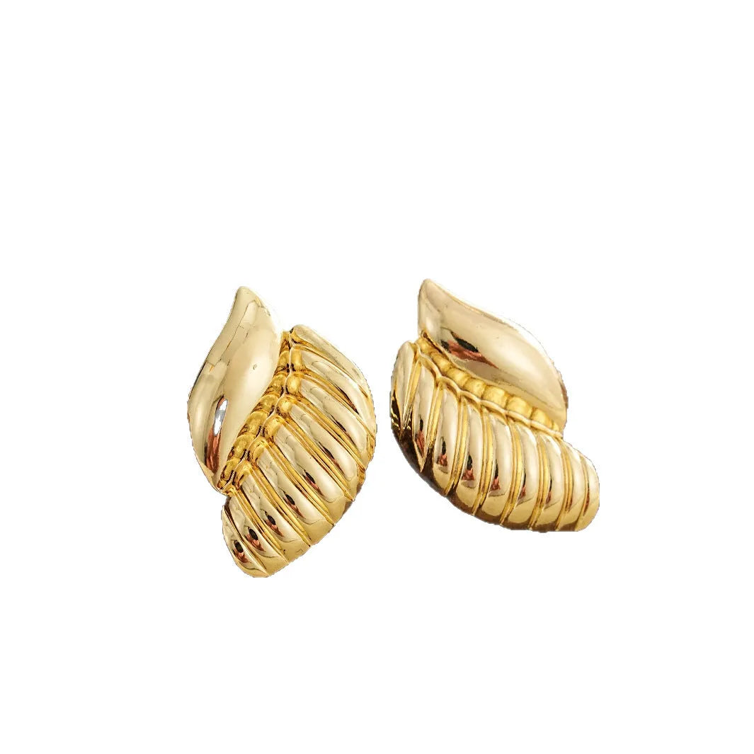 Pair of gold threaded water drop earrings for women on white background