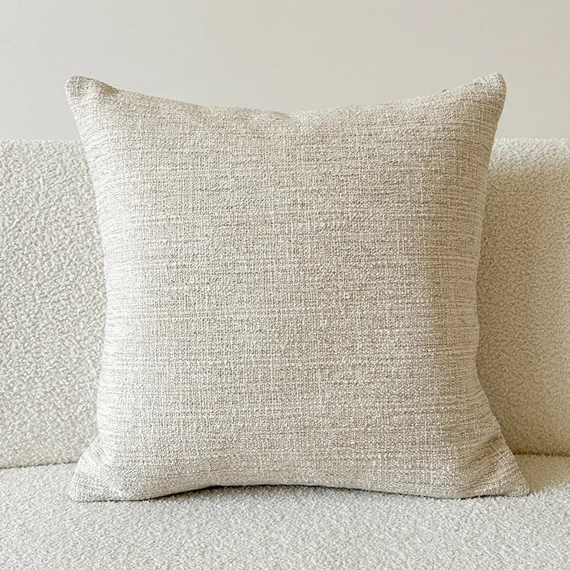 American-style yarn-dyed jacquard pillow cover with paisley pattern in amber colours on sofa