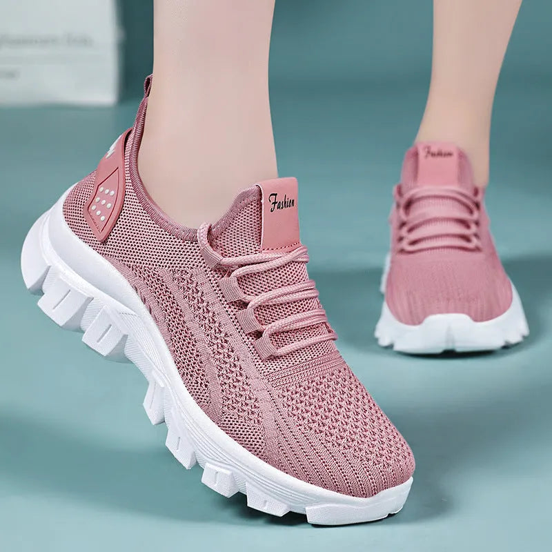 Women's white flyknit running sneaker with thick PVC sole and lace-up front