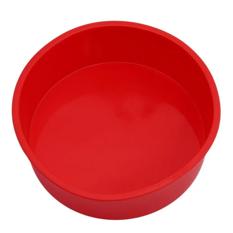 Set of three round red silicone cake moulds in 4-inch, 6-inch, and 8-inch sizes.