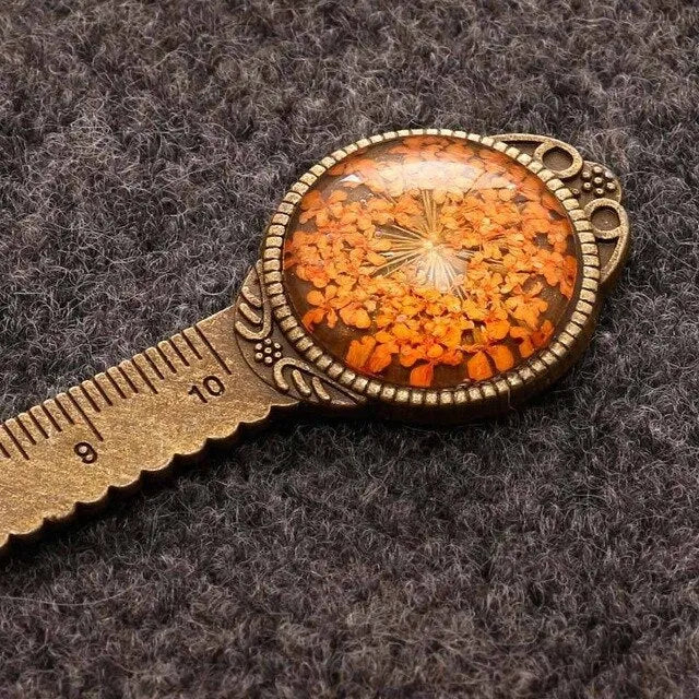 Handmade dried flower ruler bookmark with gypsophila, daffodil, lace flower, and clover on 12cm base in multiple colours.