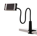 Black bedside oversize flat panel handset phone holder with long adjustable arm mounted on a table