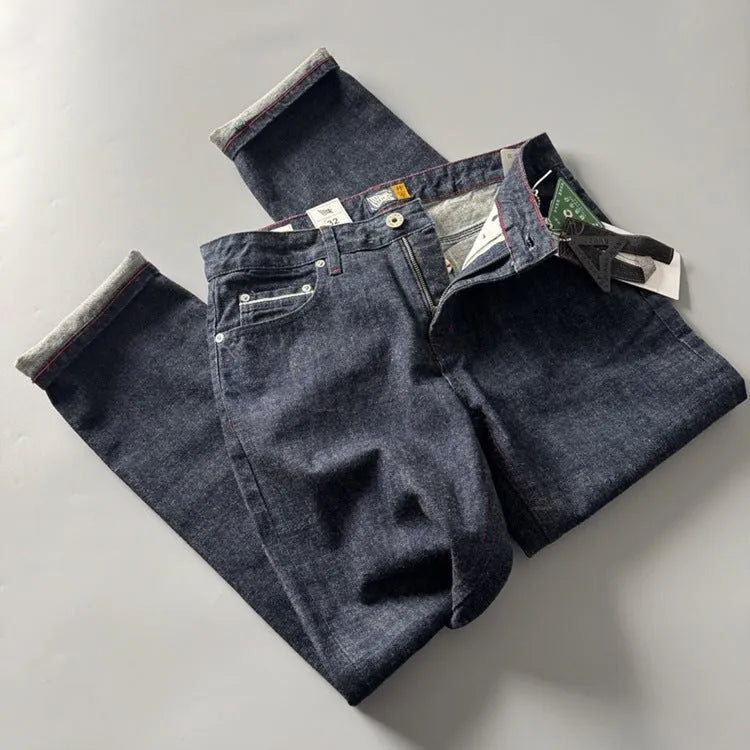 Men's straight leg cotton denim trousers in primary colour with mid-rise waist and retro American style.