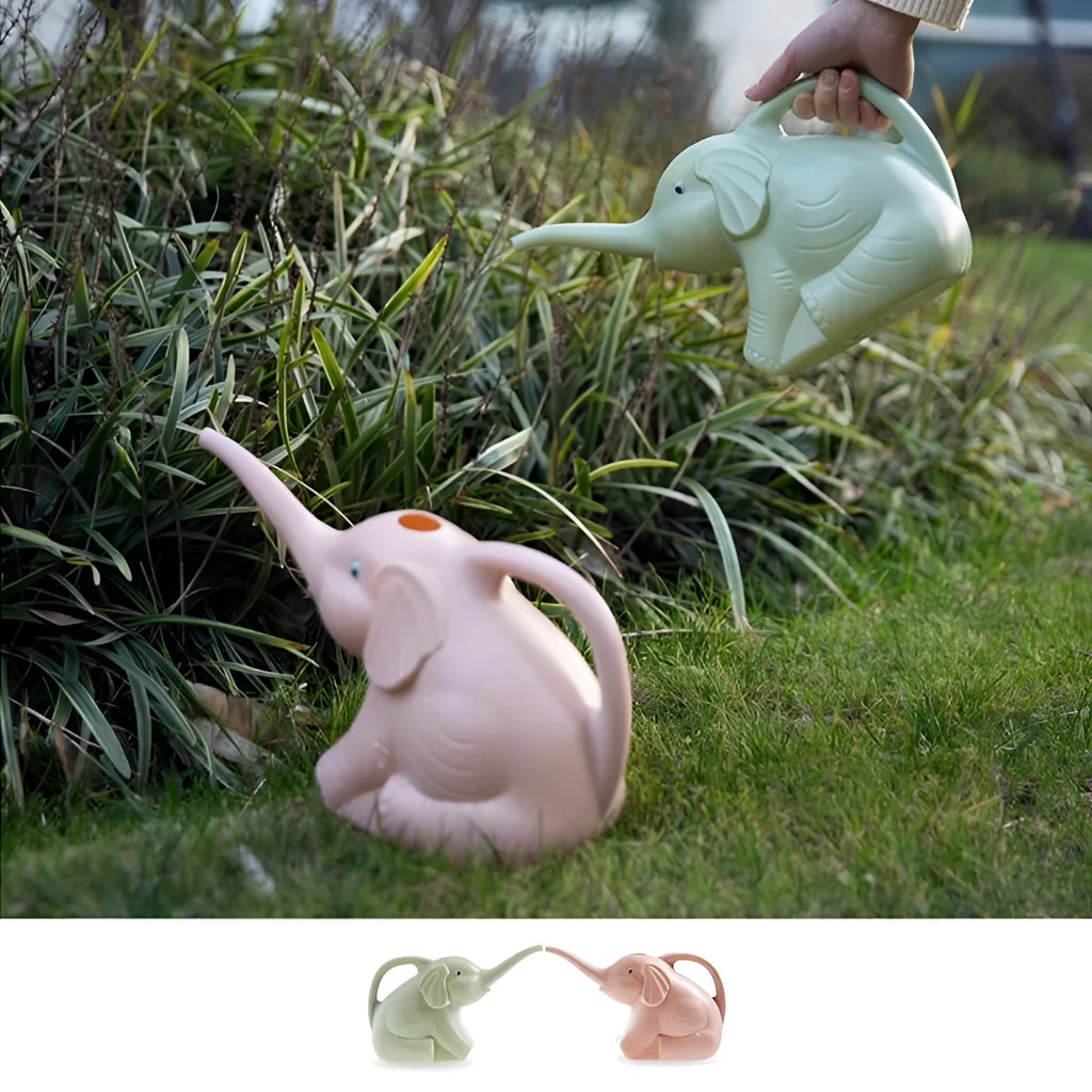 Pink children's watering can shaped like a sitting baby elephant with a long spout and bottle-shaped handle.