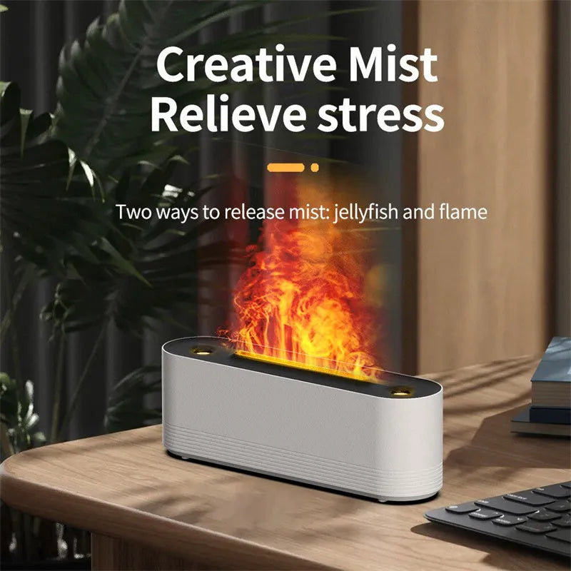 Tall black ultrasonic aroma diffuser with coloured flame LED light and rising water mist on a desk.