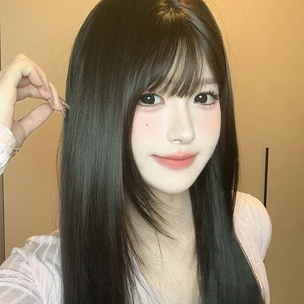 Dark brown synthetic long straight wig with bangs on wig head