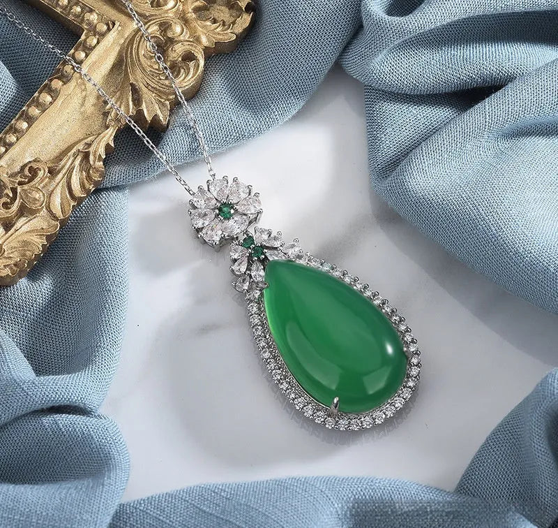 Green chalcedony water drop pendant with inlaid stone and electroplated copper geometric ellipse setting