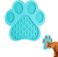 Blue silicone dog licking mat with bone texture and suction cups on a white tile background.
