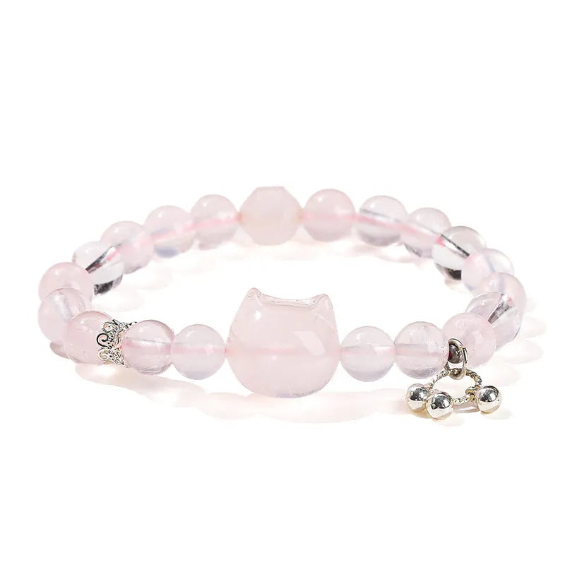Women's natural starlight pink crystal cat head bracelet with copper detail and geometric round beads