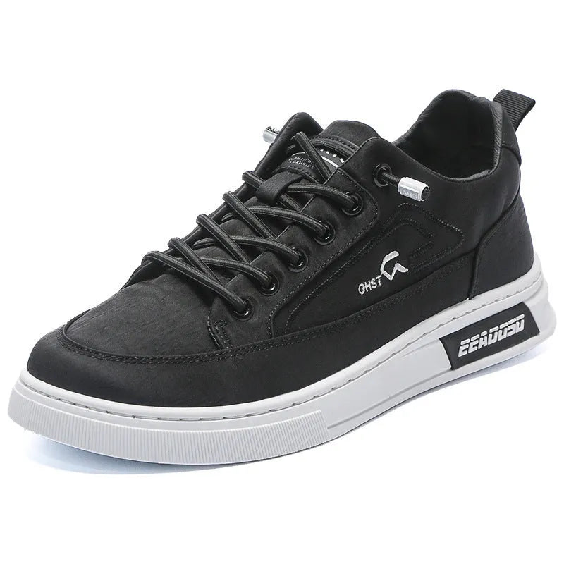 Grey men's canvas lace-up sneakers with round toe and low-top design on a rubber sole.