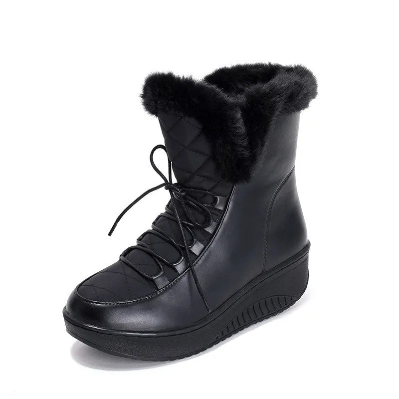 Women's black lace-up winter ankle boots with a platform sole on a white background.