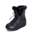 Women's black lace-up winter ankle boots with a platform sole on a white background.