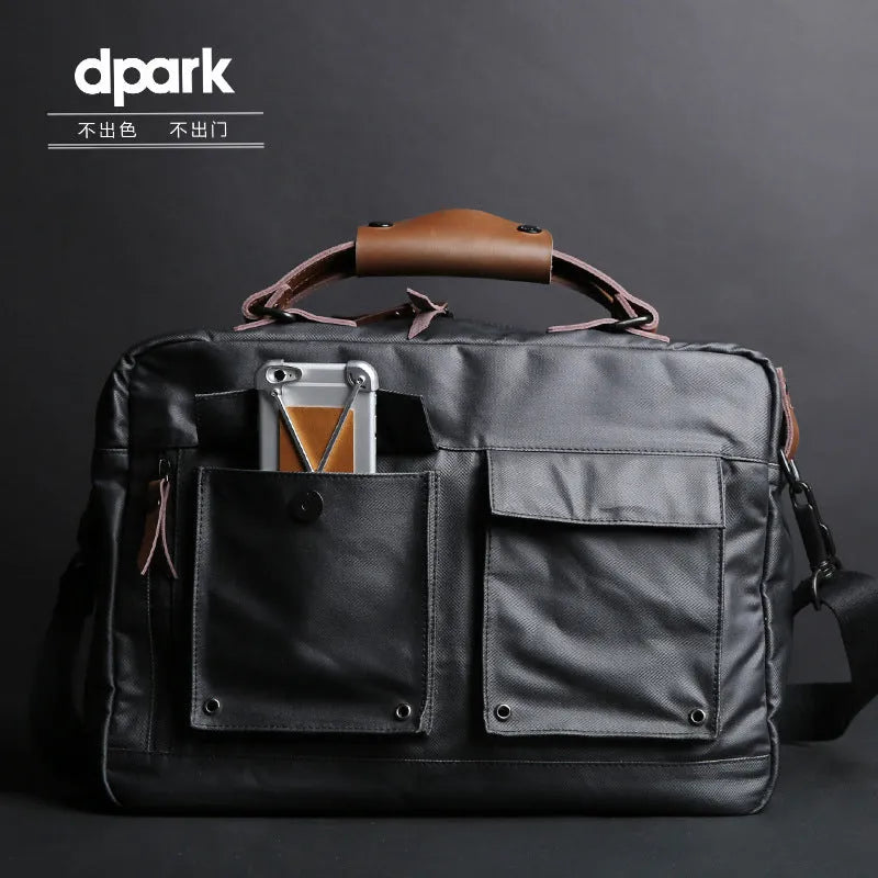 Dpark black men's shoulder bag for 14 or 15 inch laptops on a table