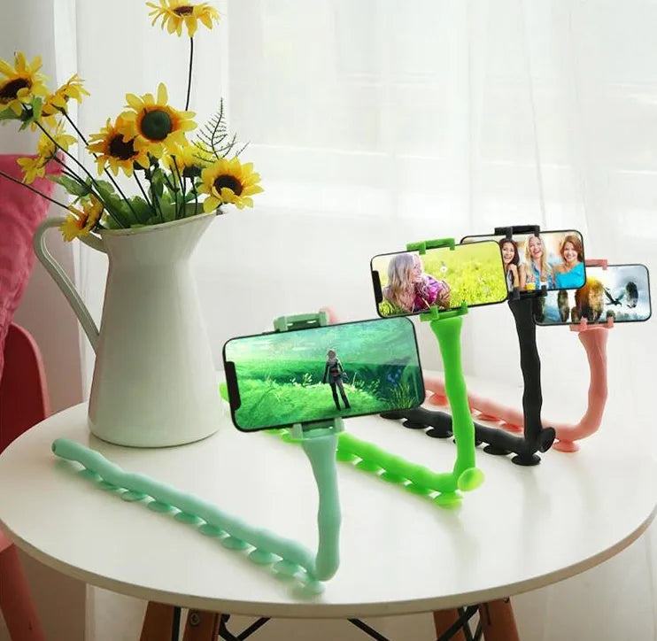Black flexible rubber phone holder with suction cup base and long worm arm extended.