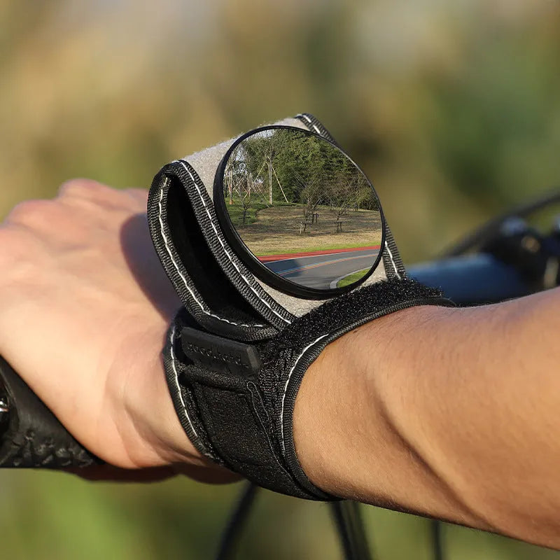 Black nylon bicycle rear-view mirror showing wrist and handlebar mounting options