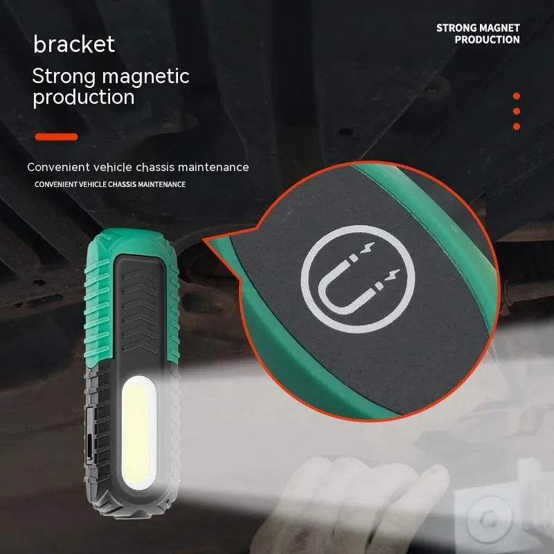 Black and green auto repair work light with USB cable for charging vehicle inspections