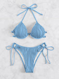 Women's black bikini swimsuit with a silver steel bracket detail on the top.