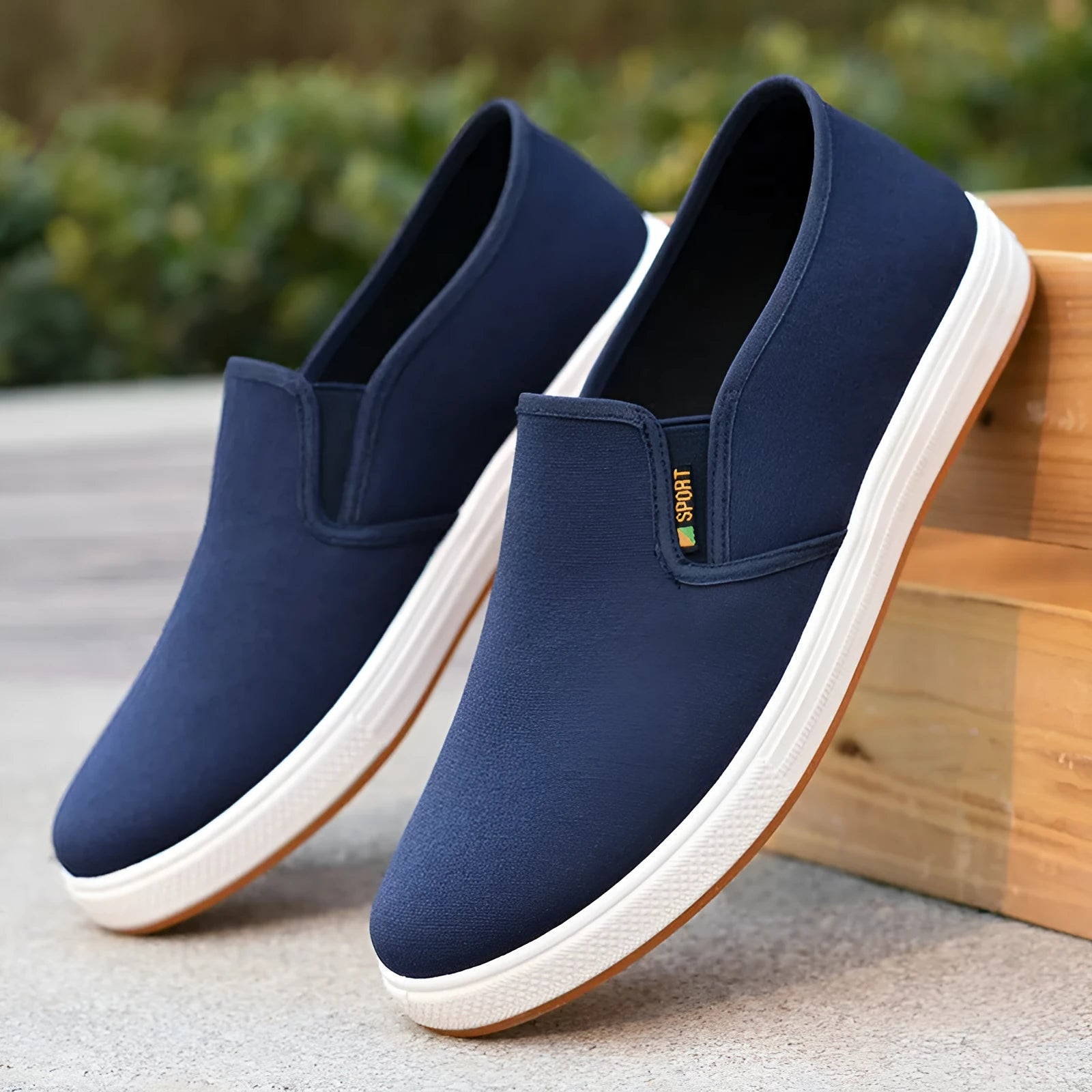 Men's black and blue canvas slip-on shoes with shallow cut design and composite soles