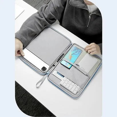 Imitation leather tablet protective case with a carry handle in light grey, shown next to a tablet.