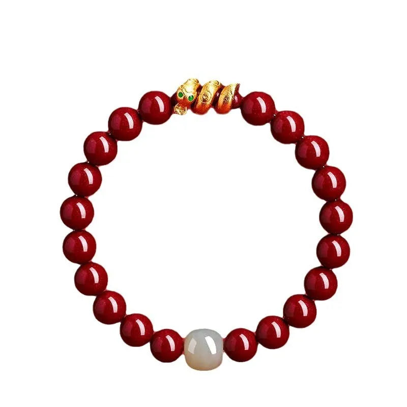 Close-up of a handmade cinnabar bracelet with snake zodiac beads in a Chinese style.
