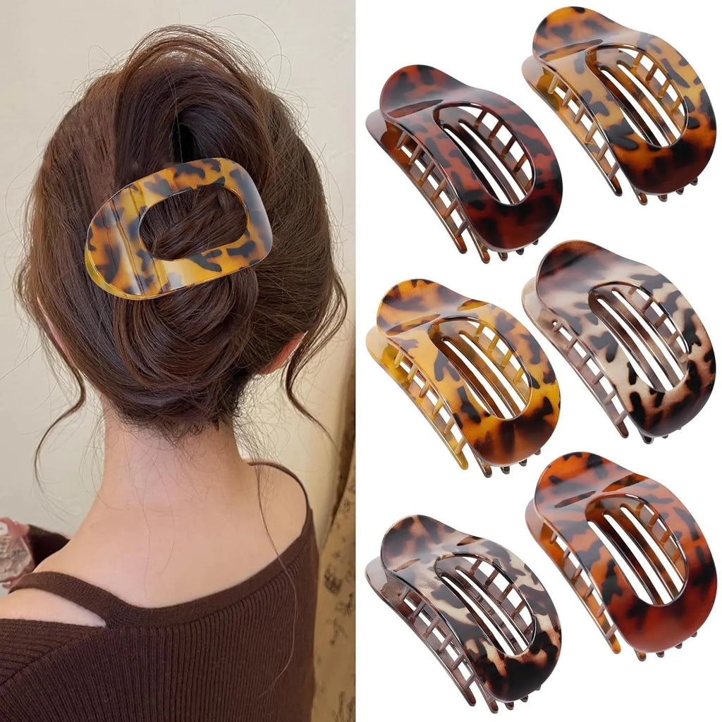 Six rose red and nude plastic hair clips with frosted grips and a quadrilateral shape.