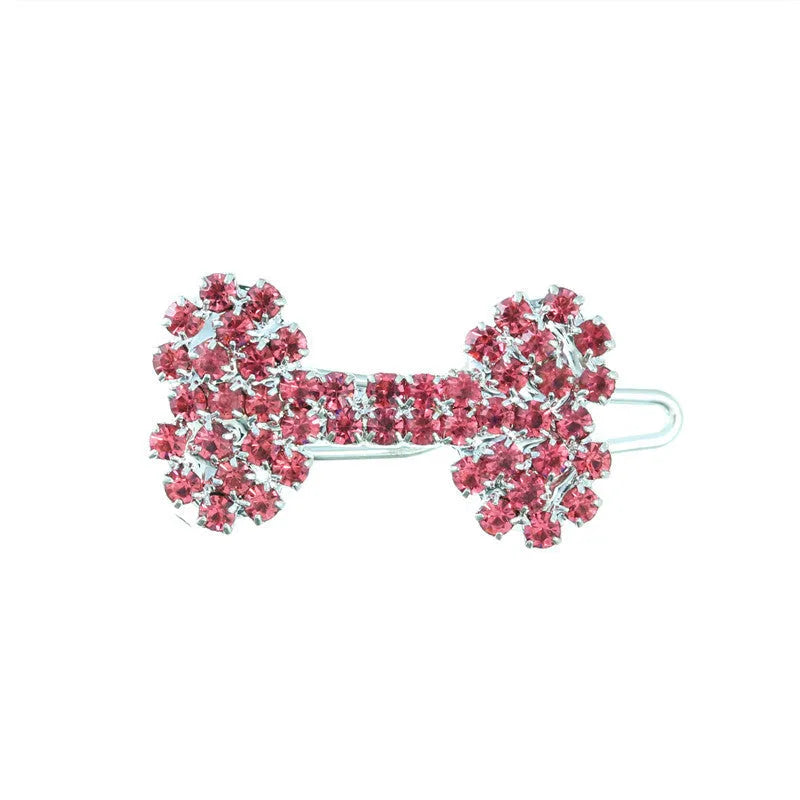 Dog bone pet barrette in size S with diamond accent, shown in white, pink, blue, and red colour options