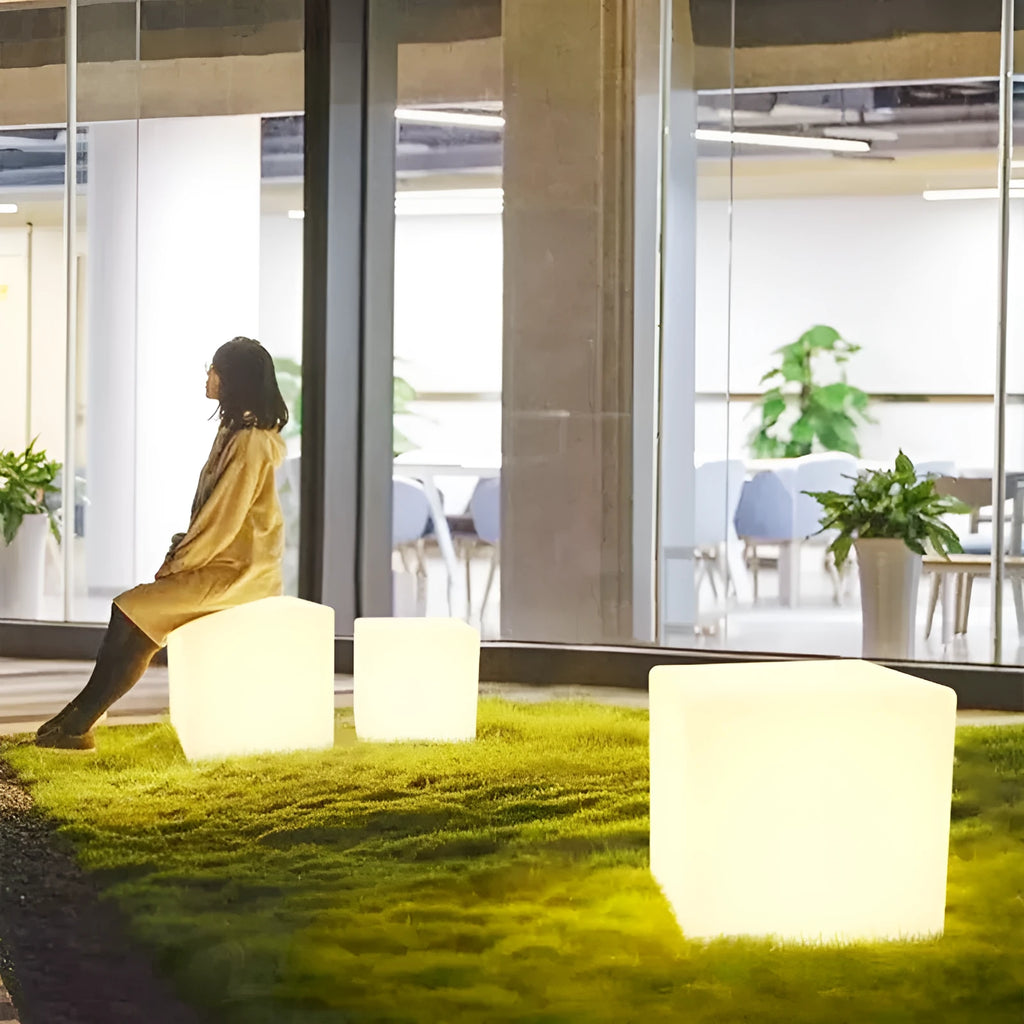 Modern square LED cube stool light for outdoor gardens, available in multiple sizes with solar or rechargeable power